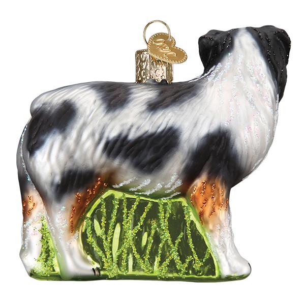 Back side view of the Australian Shepherd ornament showing its merle coat and grass base