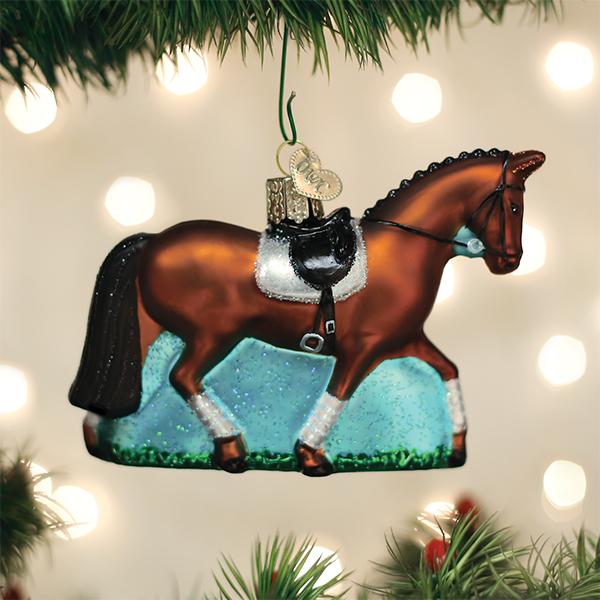 Dressage horse ornament hanging on a Christmas tree with glowing lights, a gift for equestrians