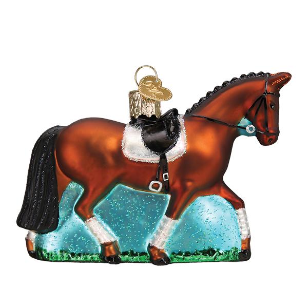 Dressage horse glass Christmas ornament, bay with black saddle, white pad, and leg wraps on a teal base, side view on white