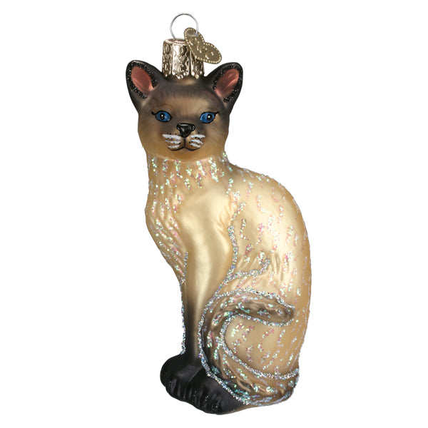 Siamese cat glass ornament, front view, cream and tan body with dark brown ears, face, and paws, on white