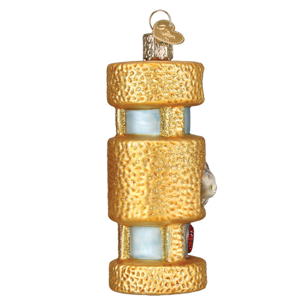 Side view of the cat tower ornament showing the gold textured levels and the kitten peeking around