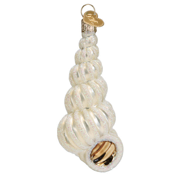 Front of the pearly white wentletrap shell glass ornament with gold-lined opening, on white