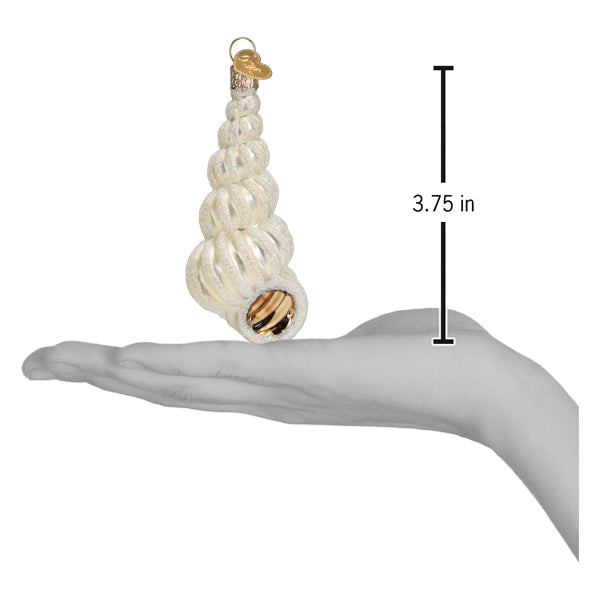 Wentletrap shell ornament on an open palm beside a 3.75 inch height marker