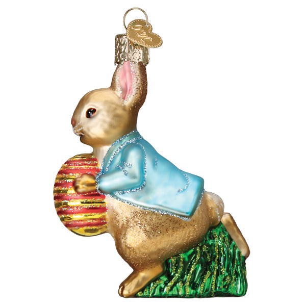 Left side of the Peter Rabbit ornament showing his blue jacket and the striped Easter egg, on white