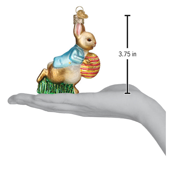 Peter Rabbit Easter egg ornament on an open palm beside a 3.75 inch height marker