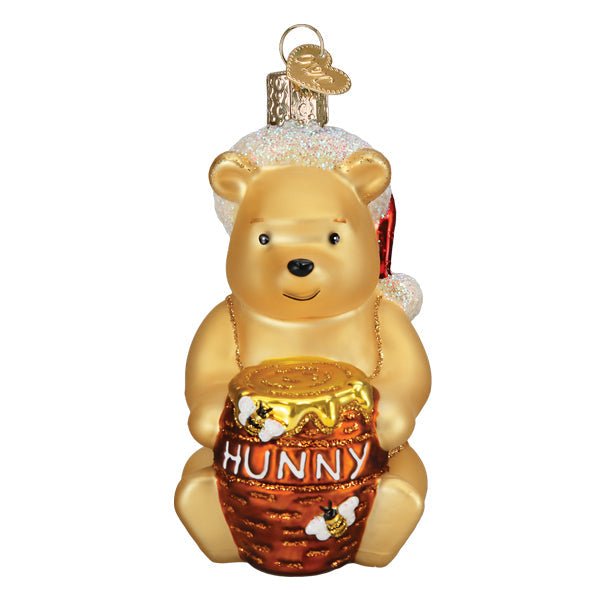 Winnie the Pooh glass ornament holding a Hunny pot for a Christmas tree