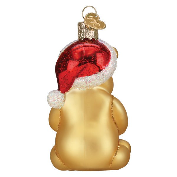 Winnie the Pooh glass ornament holding a Hunny pot for a Christmas tree