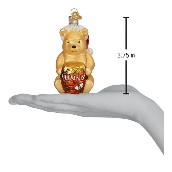 Winnie the Pooh glass ornament holding a Hunny pot for a Christmas tree