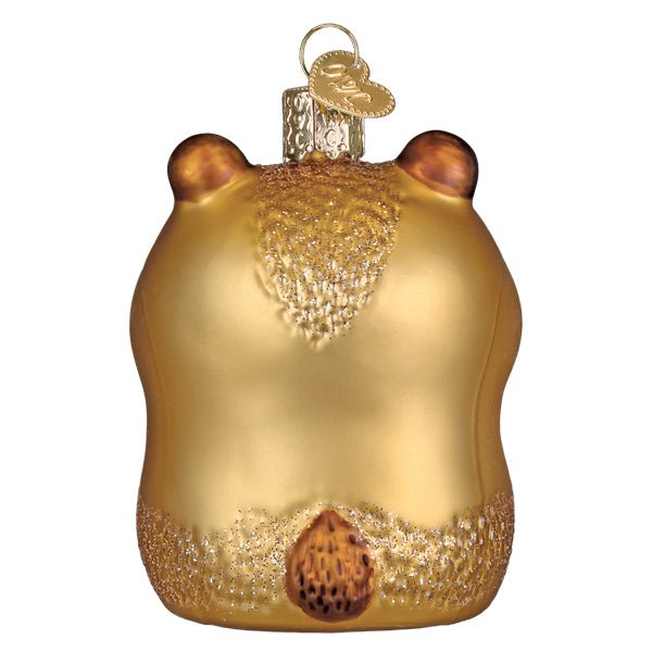Back of the capybara ornament showing glittered fur and a small brown tail, on white