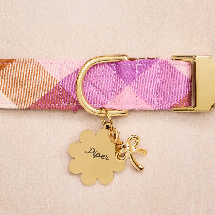 Pink and lilac plaid dog collar with a scalloped gold tag and gold bow charm