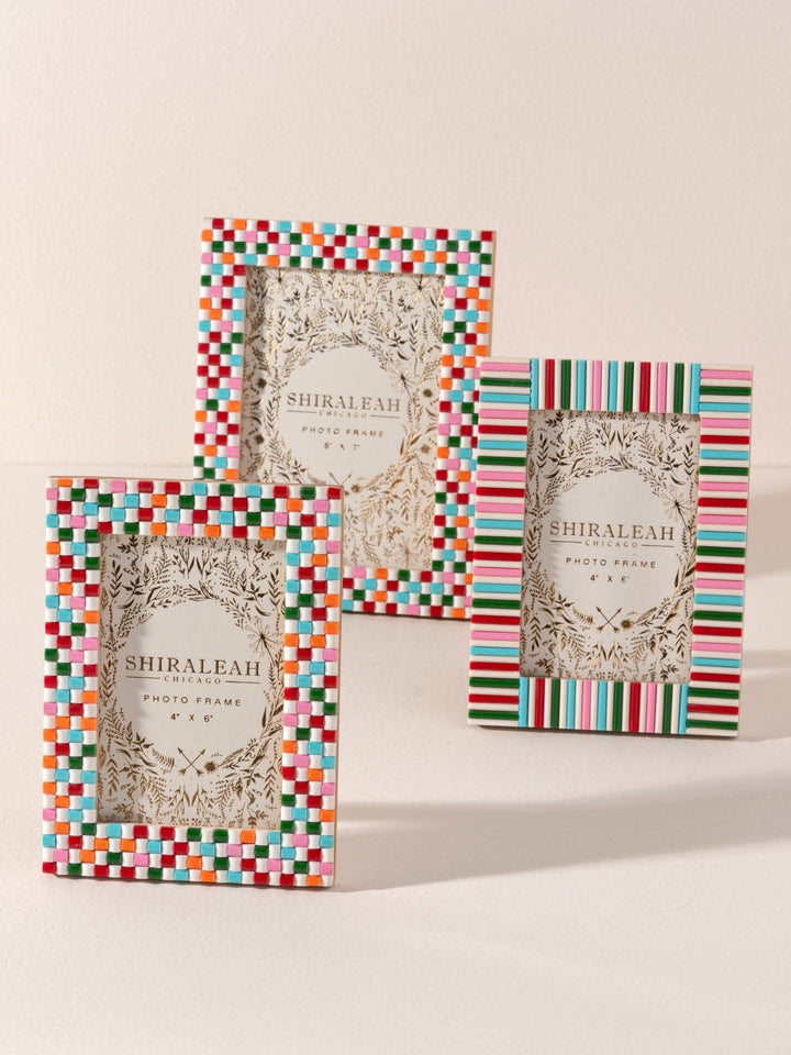 Three Shiraleah decorative photo frames with colorful striped and checkered borders, displayed on a light beige background.