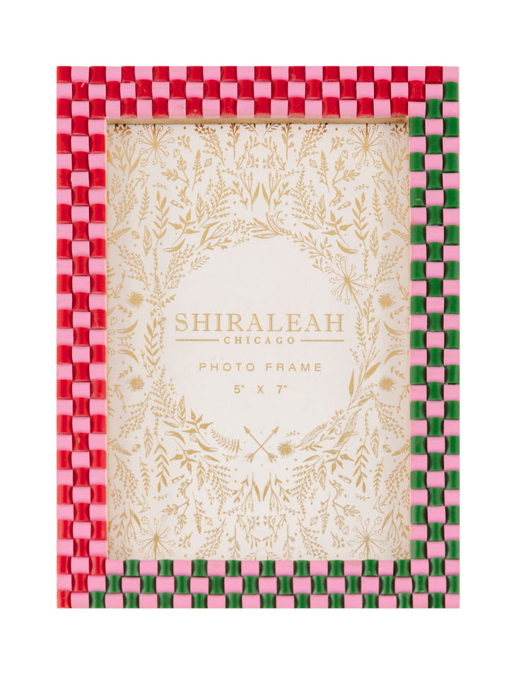 Pink, red, and green checkerboard 5 by 7 inch picture frame with a gold patterned insert card, on a white background