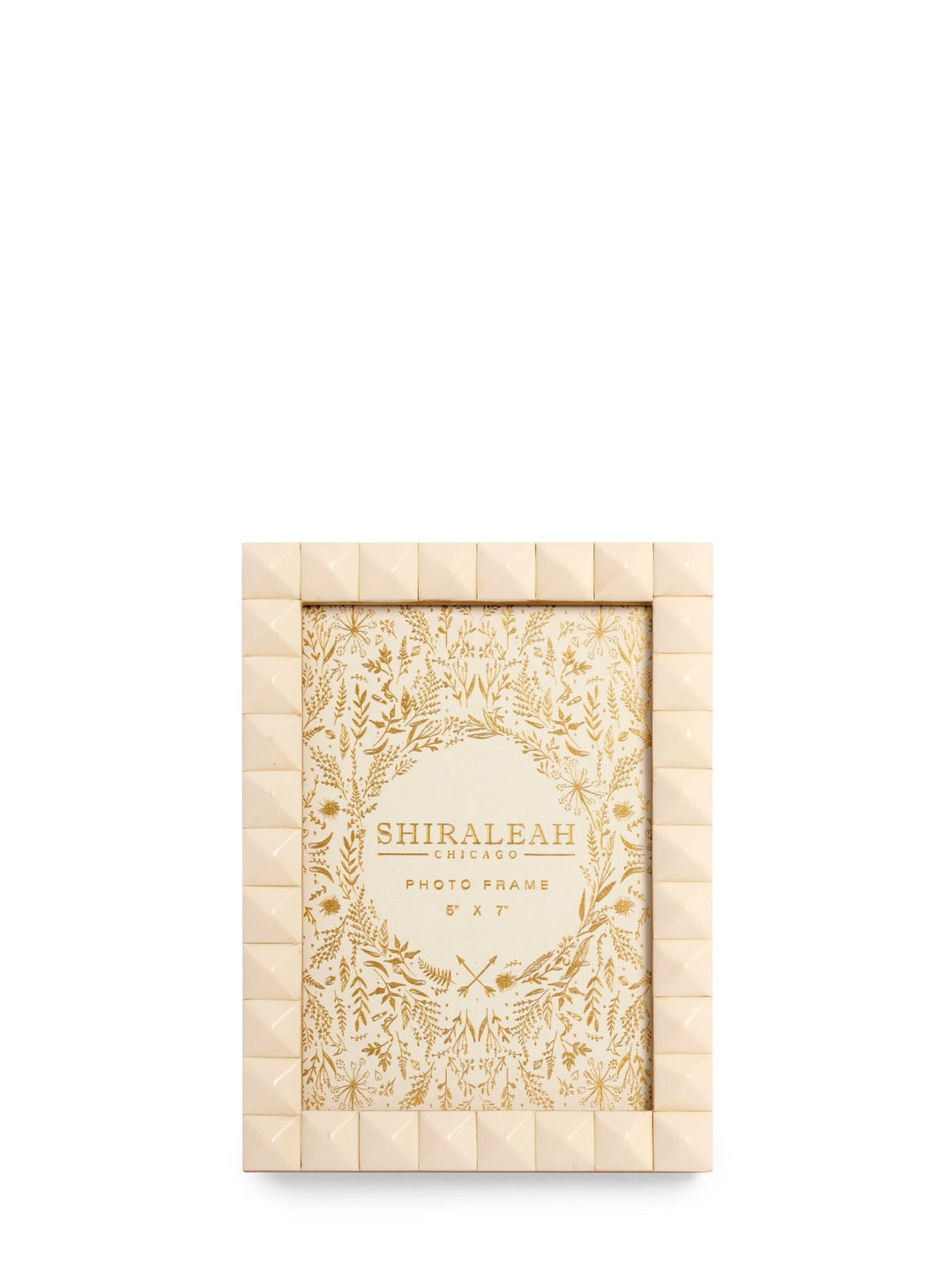 A rectangular photo frame with a textured, quilted cream border and a central floral patterned insert, shown on a plain white background. The brand name 'SHIRALEAH' is printed on the insert.