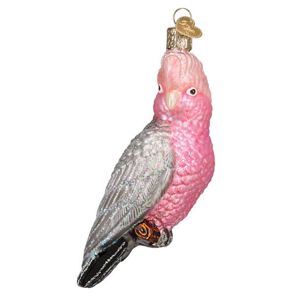 Rose-breasted cockatoo ornament in side view with pink crest and chest and grey wings, on white