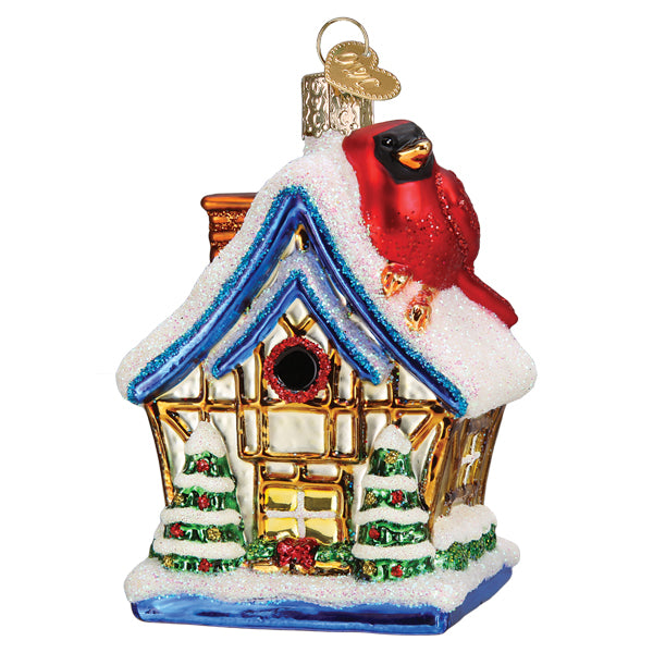 Front of the cardinal birdhouse ornament, a red cardinal on a snowy roof with blue trim, on white