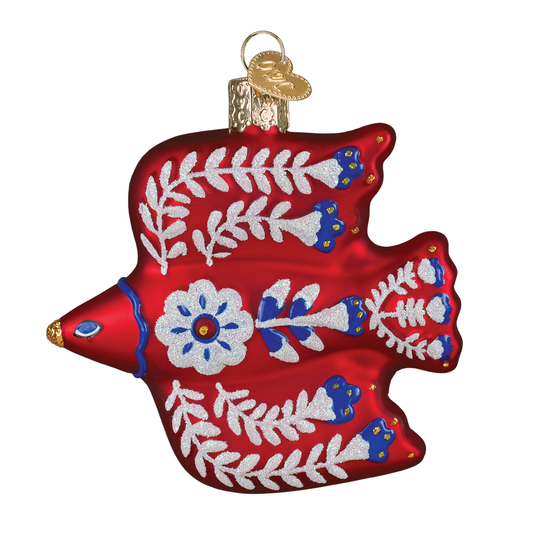 Front of the red folk art thrush ornament painted with white vines, blue blossoms, and a daisy, on white