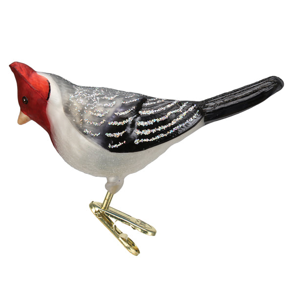 Side view of the red-crested cardinal clip-on ornament with a red head and gray wings, on white