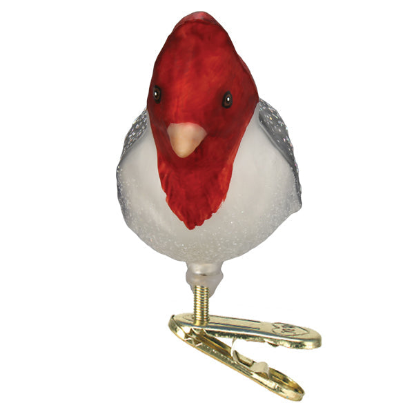 Front of the red-crested cardinal ornament with its red crest and white chest on a gold clip