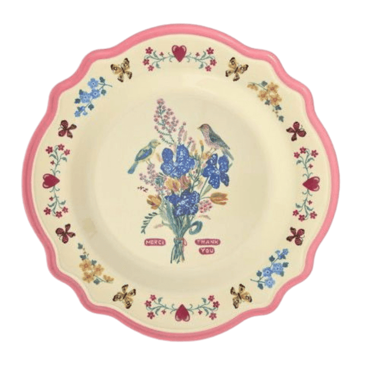Nathalie Lété melamine dinner plate with a blue and purple wildflower bouquet and bird, neon pink scalloped rim, top view