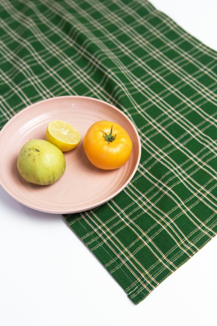 Forest green plaid table runner set for a holiday dinner