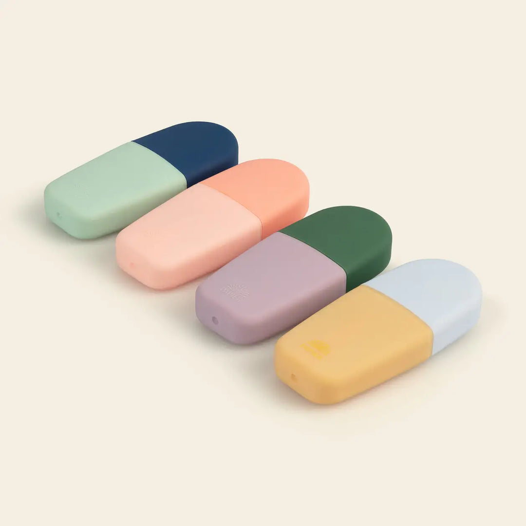 Bright Ideas mini highlighter set of 4 in soft pastel two tone cases laid on a cream surface, cute study supplies