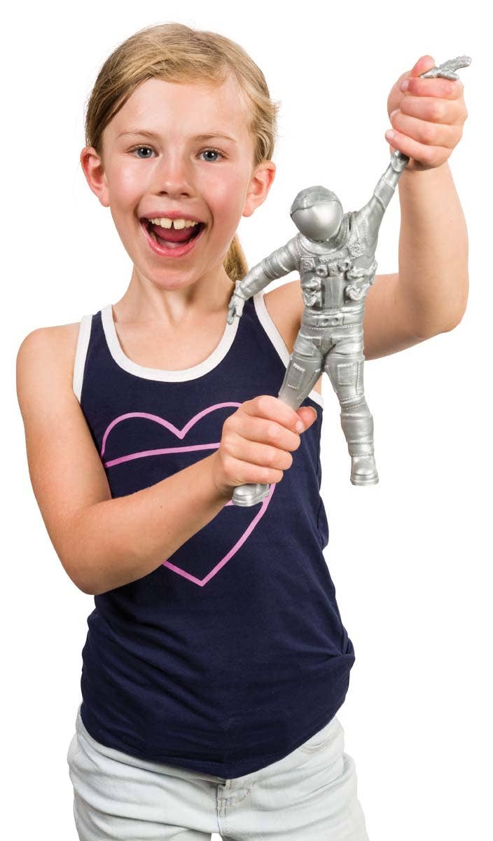 Girl stretching the silver astronaut toy overhead, a squishy sensory prize for space parties