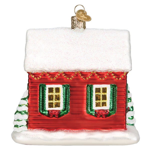 Back of the You're Home house ornament with two shuttered windows and a snowy roofline, on white