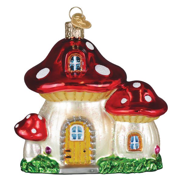 Front of the mushroom house ornament with red spotted caps, a yellow arched door, and blue windows, on white