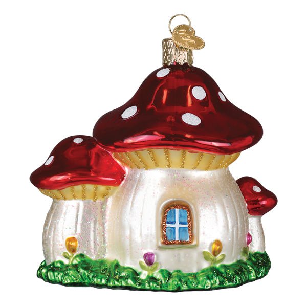 Back of the mushroom cottage ornament with a round blue window and grass trim, on white