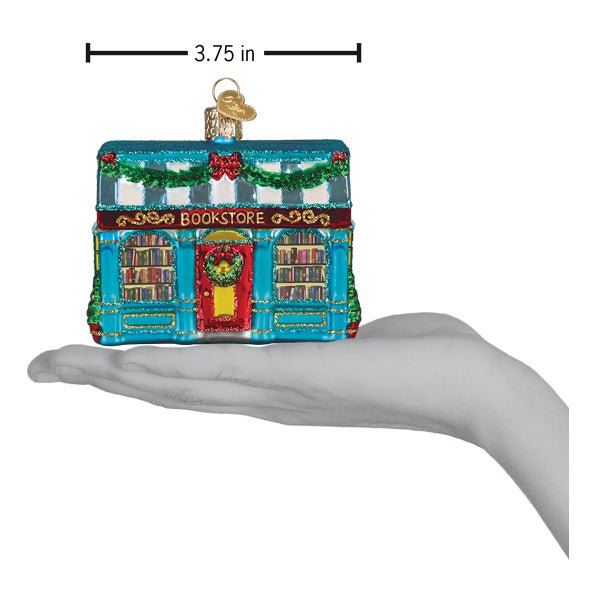 Bookstore ornament held above an open palm with a 3.75 inch width marker for scale