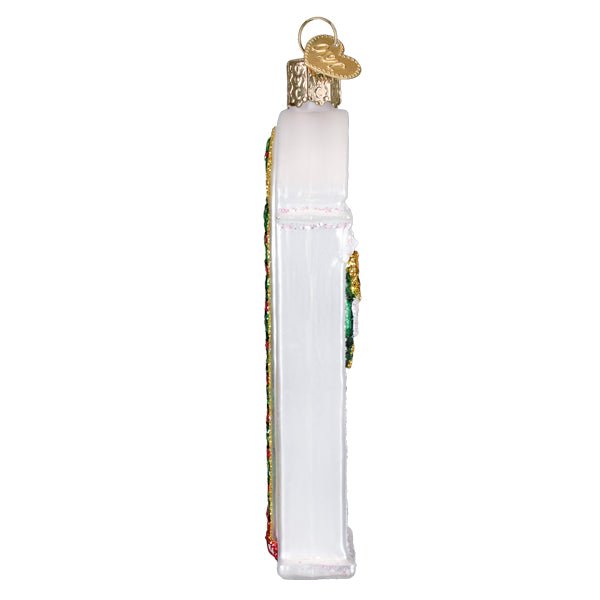 Side view of the New Home door ornament showing its slim, flat profile