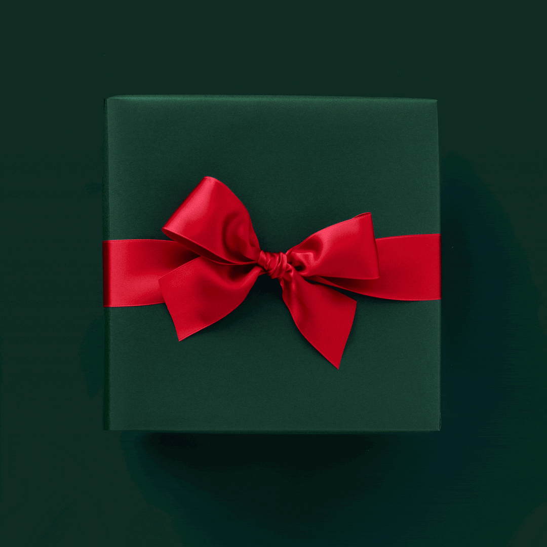 Animated clip opening on a dark green gift box with a red bow