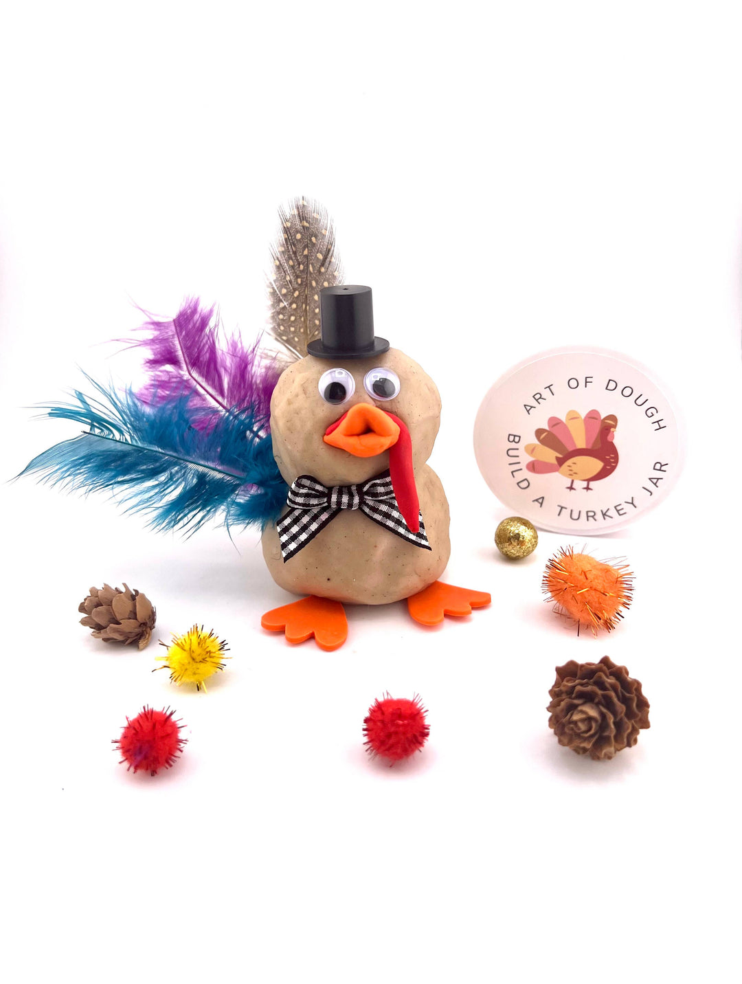 Turkey sensory jar with handmade dough, feathers, and googly eyes for Thanksgiving crafts, Bonjour Fete