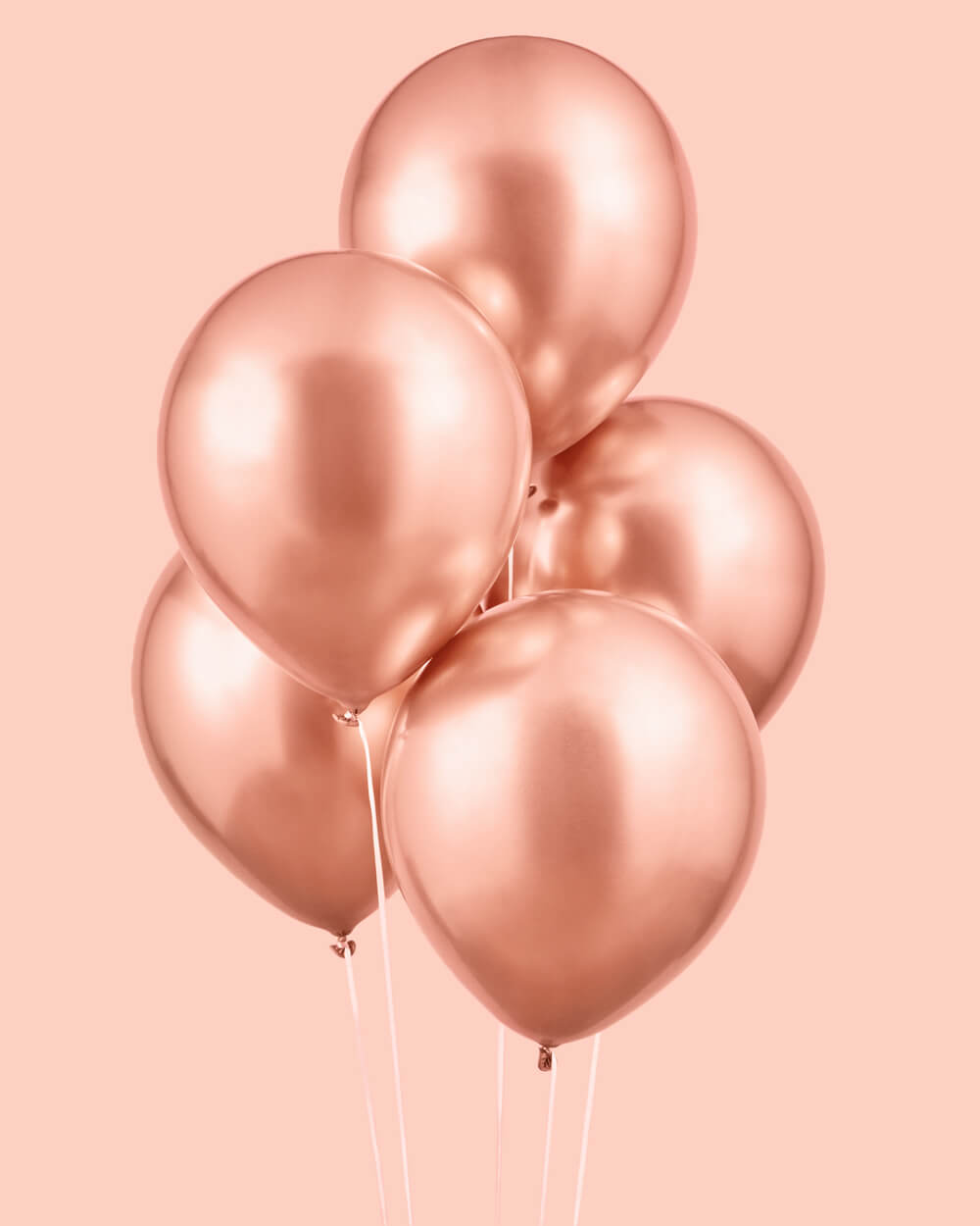 Rose gold chrome balloons styled at a party