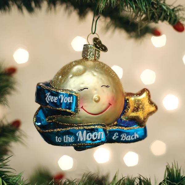 Smiling gold moon glass ornament with a blue Love You to the Moon and Back banner on a Christmas tree