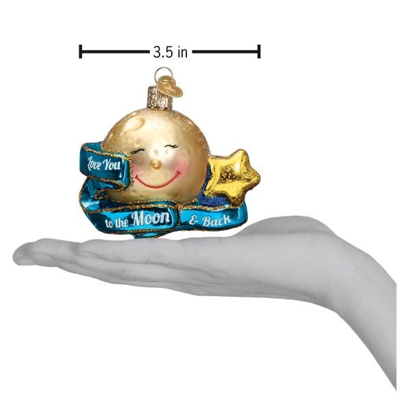 Love you to the moon ornament on an open palm under a 3.5 inch width marker