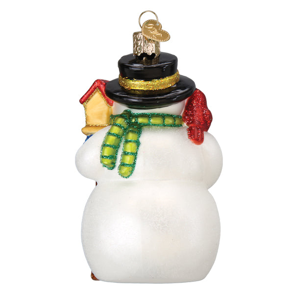 Back of the snowman ornament showing his green scarf and the yellow birdhouse