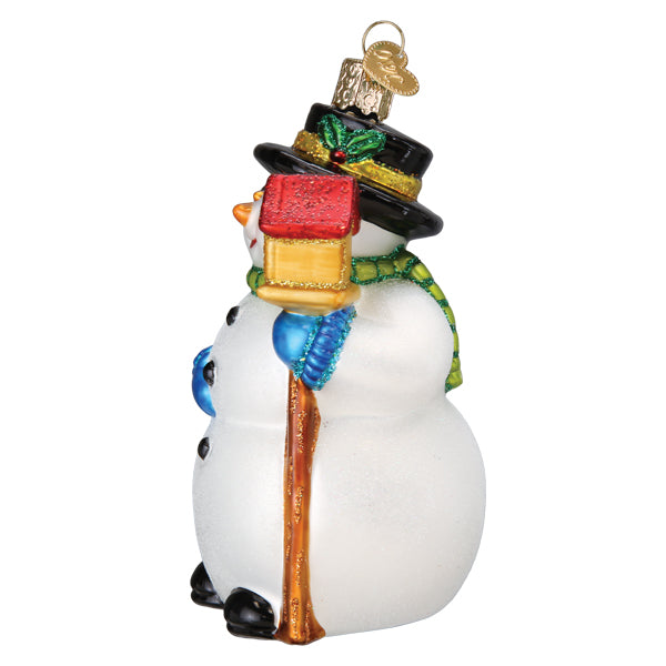 Side of the snowman ornament holding the wooden birdhouse staff