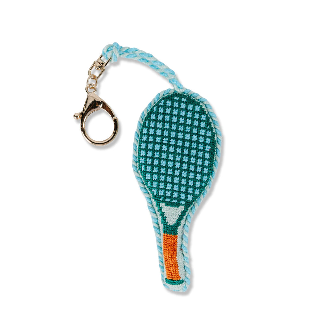 Teal tennis racket needlepoint bag charm with an orange grip and gold clip for a tennis or pickleball lover gift