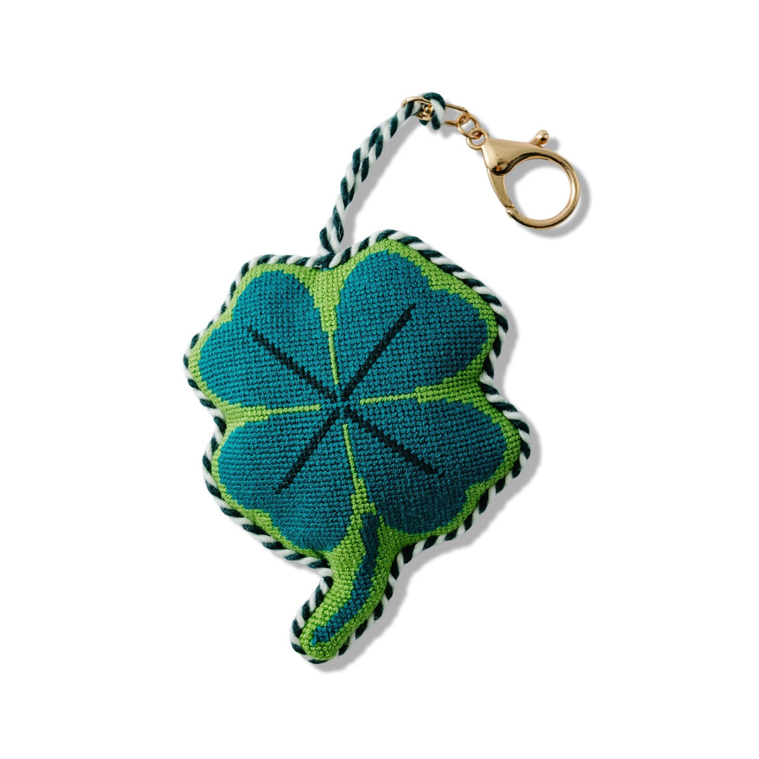 Four leaf clover needlepoint bag charm in teal and green with a gold clip for a St Patrick's Day or good luck gift