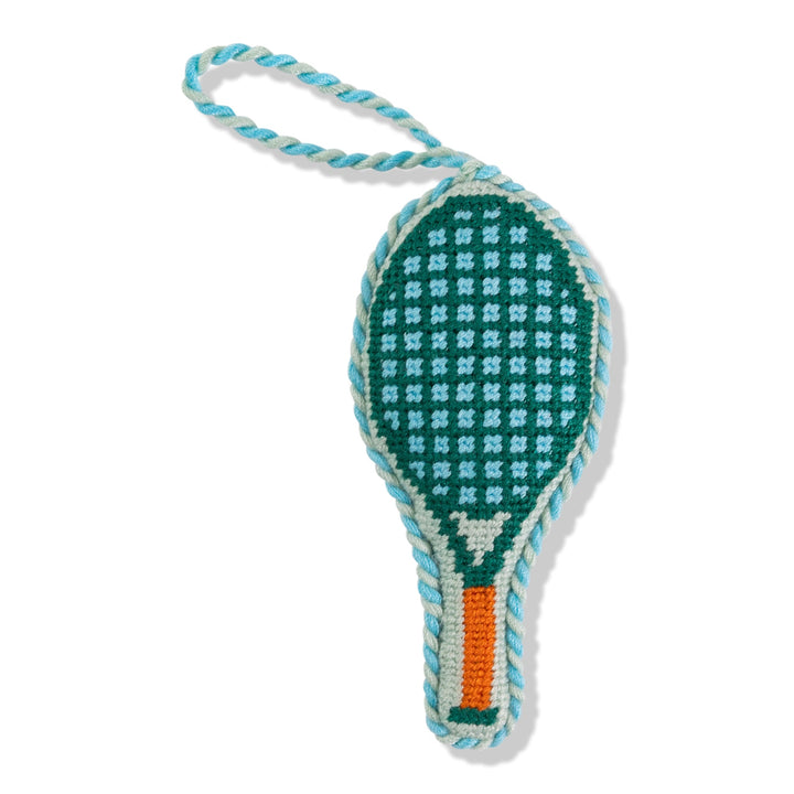 Tennis racket needlepoint ornament, front view in green with mint strings, orange grip, and mint cord