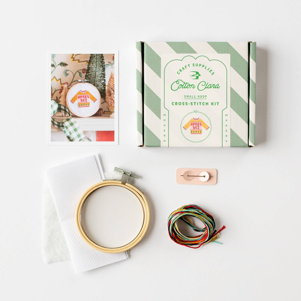 Apres ski cross stitch kit box with hoop, fabric, needle card, and thread