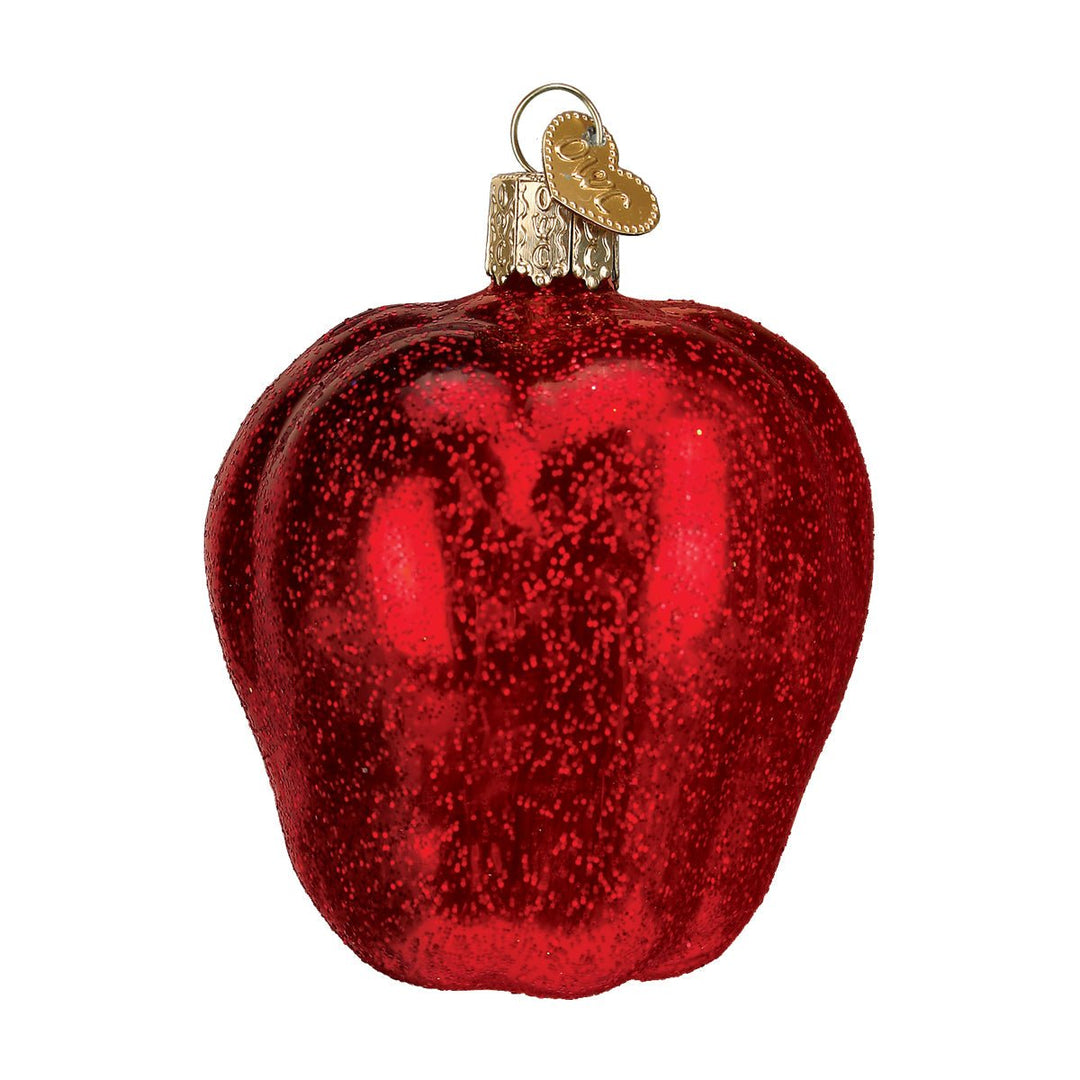 Red Delicious apple glass Christmas ornament in deep red glitter with a gold cap, front view on white