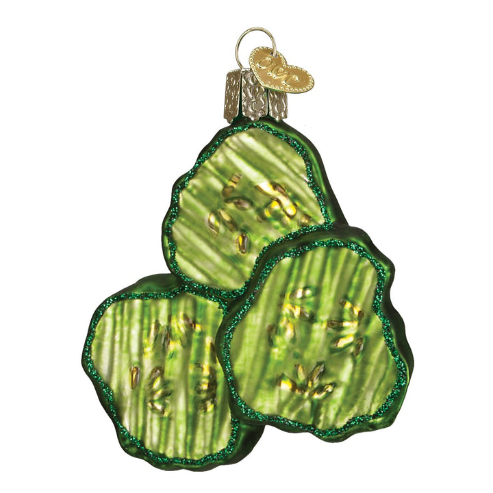 Three crinkle-cut green pickle chips glass ornament with glitter, on white