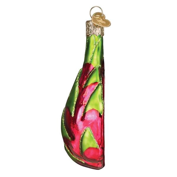 Side view of the dragon fruit ornament with curling green scales up to the stem, on white