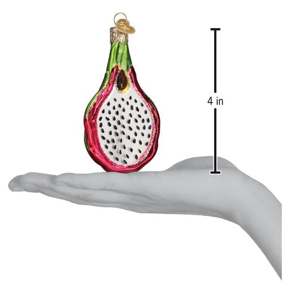 Dragon fruit ornament on an open palm beside a 4 inch height marker