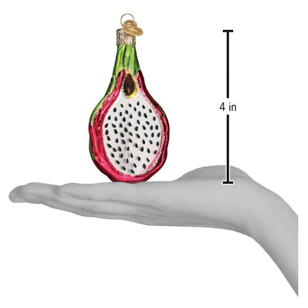 Dragon fruit ornament on an open palm beside a 4 inch height marker