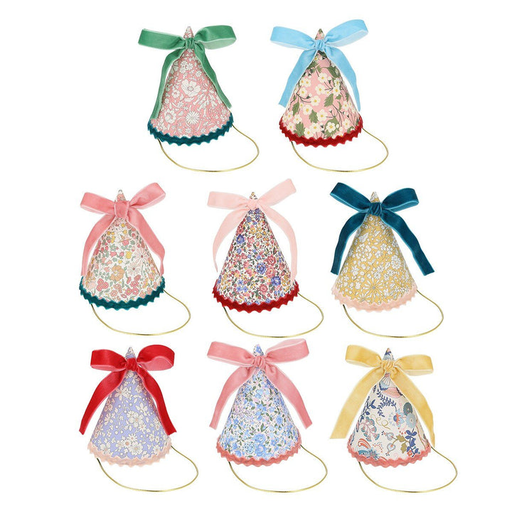 Meri Meri X Liberty party hats on white background with colorful Liberty floral print cone hats for birthdays