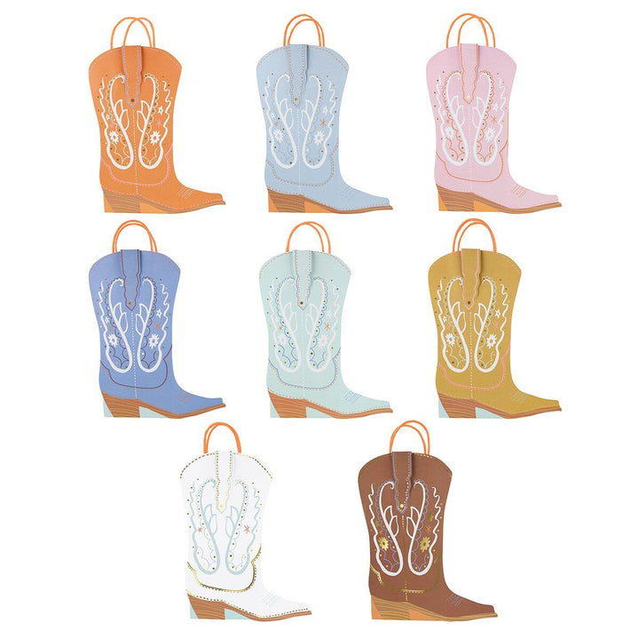 Meri Meri western boot party favor bags on white background, cowboy boot shaped bags for western or rodeo birthday parties