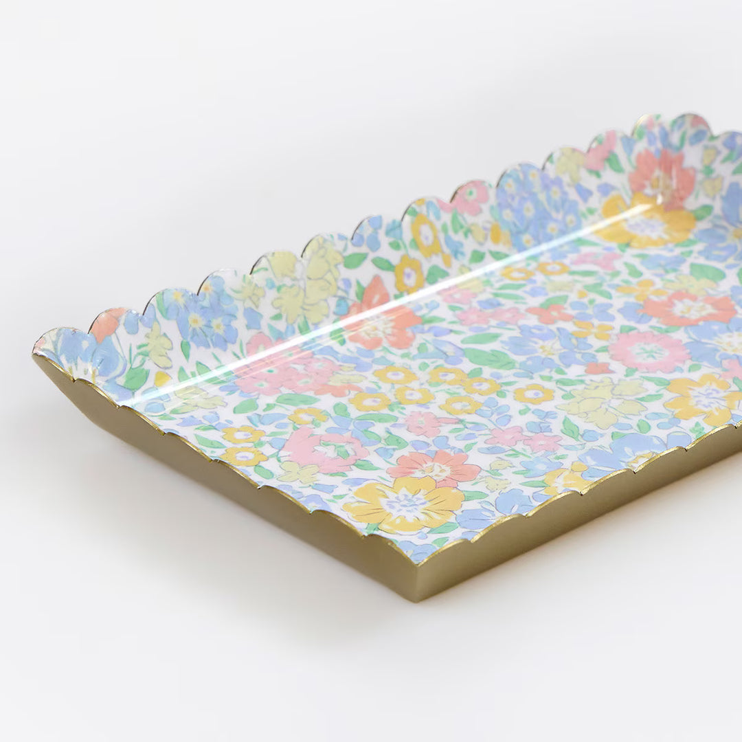 Close-up of a Meri Meri x Liberty floral metal accessory tray with a glossy finish and scalloped edges.